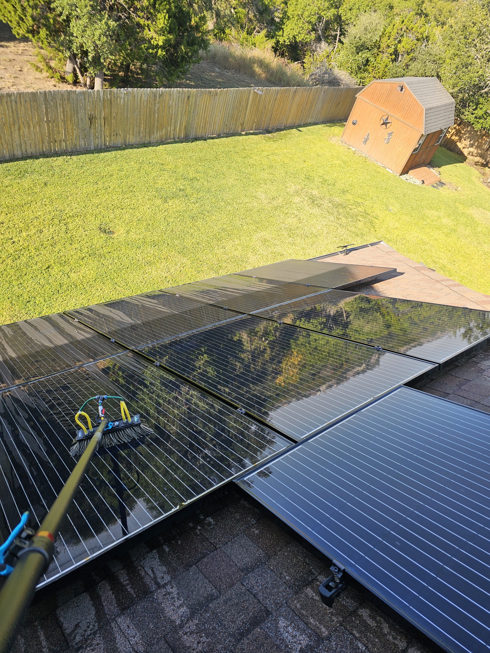 Solar panel cleaning on a residential roof