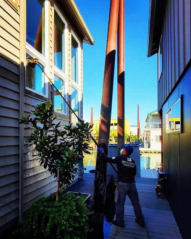 Window and gutter cleaning at a floating-home dock